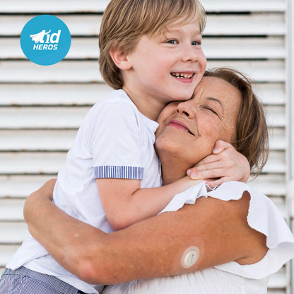 Child hugging an older woman with a T1dHEROS logo in the corner.