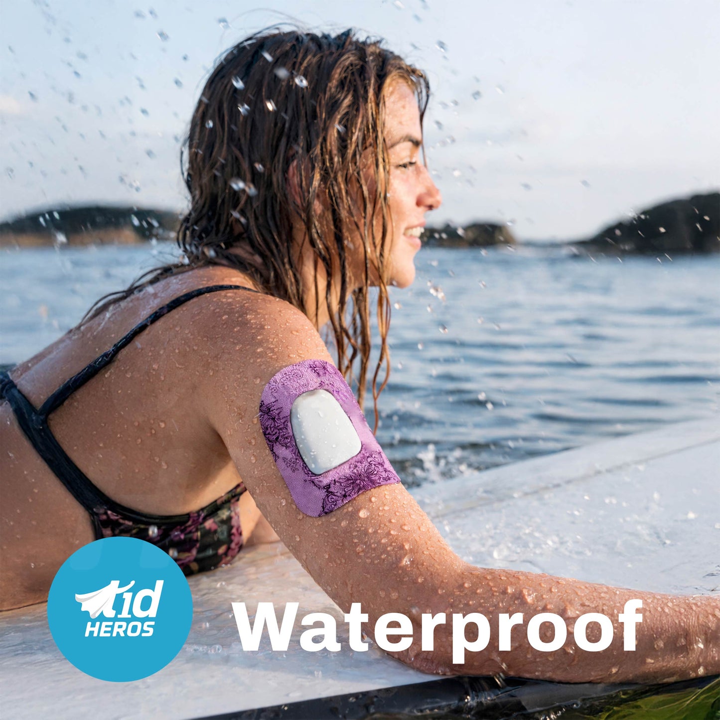 Woman sitting by a lake with a waterproof arm patch on her arm, featuring the T1Heroes brand.
