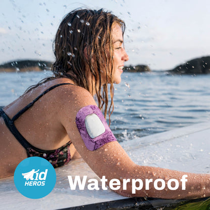 Woman sitting by a lake with a waterproof arm patch on her arm, featuring the T1Heroes brand.