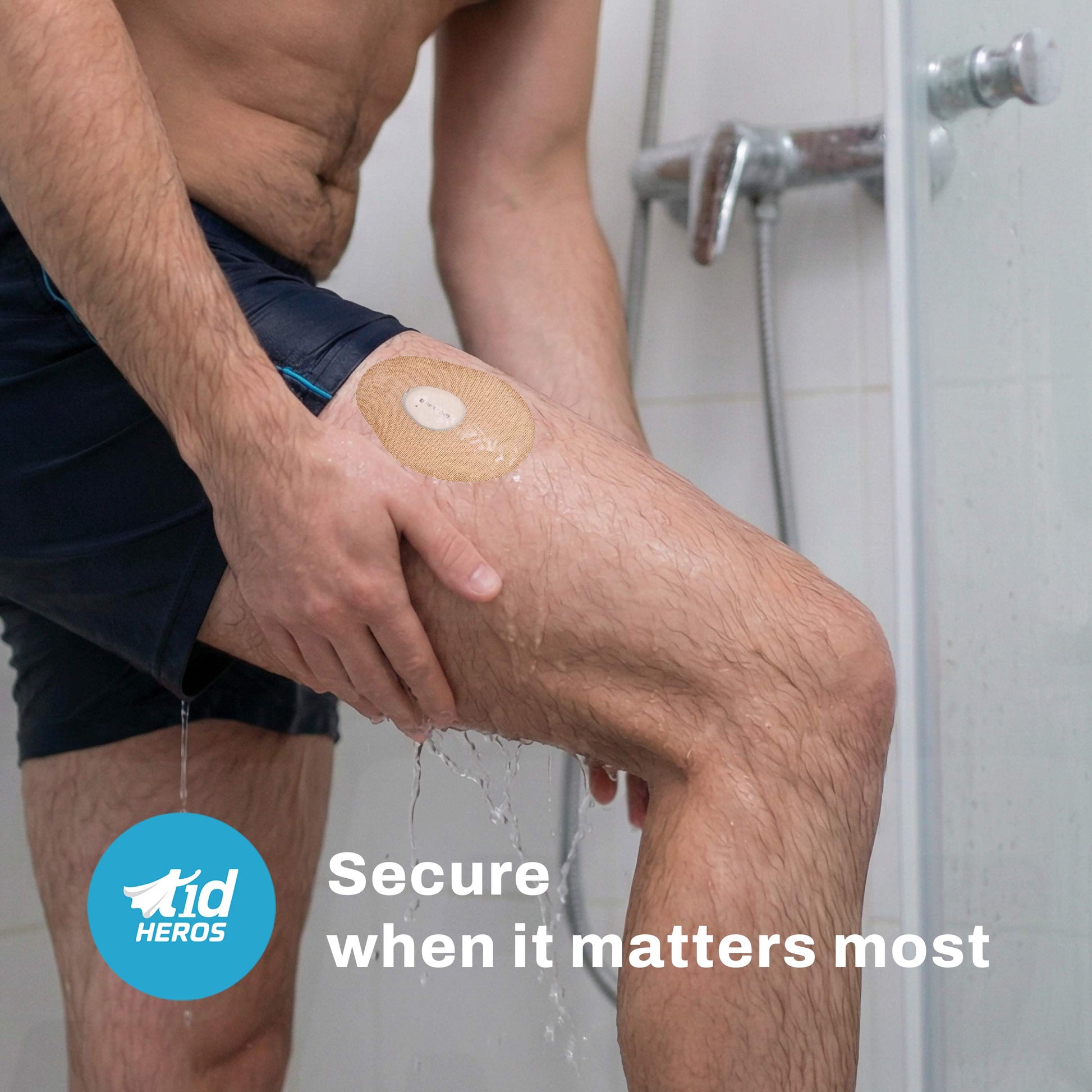 Person applying a bandage to their knee in a bathroom setting with TidHEROS branding.